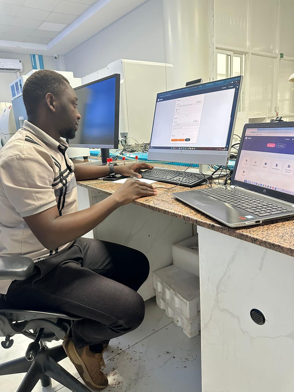 Healthcare professional reviewing laboratory workflow data